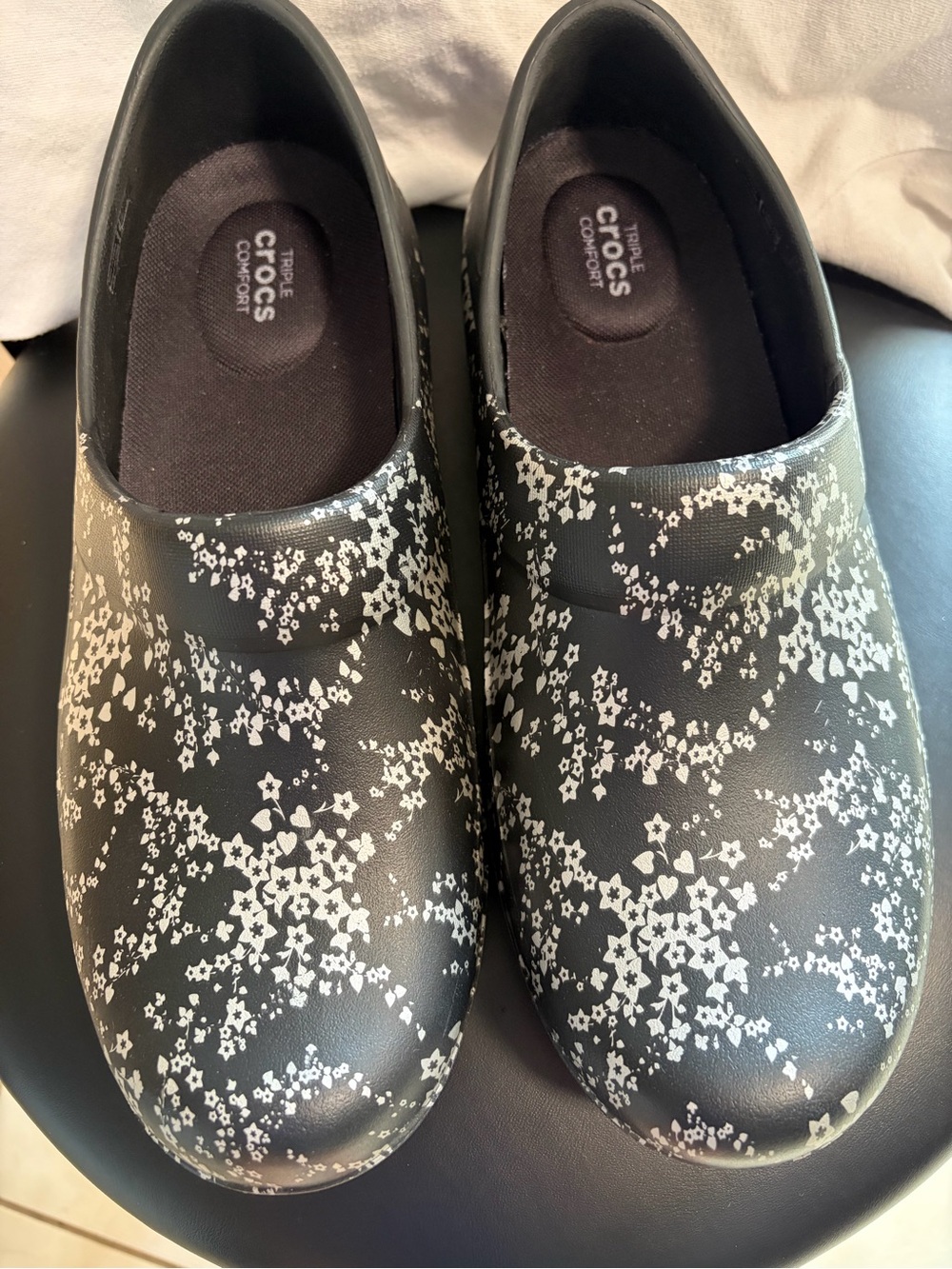 CROCS Black Slip-On Clogs with White Floral Print